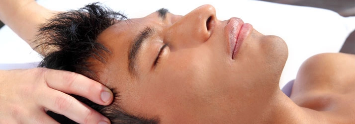 Close-up of a person receiving a head massage